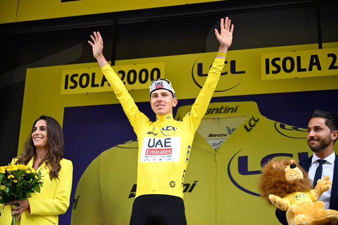 19 July 2024, France, Isola 2000: Slovenian cyclist Tadej Pogacar of UAE Team Emirates celebrates on the podium after winning the 19th stage of the 111th edition of the Tour de France cycling race, 144,6 km between Embrun and Isola 2000. Photo: Tom Goyvae