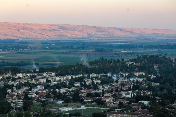 KIRYAT SHMONA, July 16, 2024  -- Smoke billow following missile attacks from Lebanon, in the city of Kiryat Shmona, northern Israel, on July 16, 2024. Hezbollah announced on Tuesday in a statement that it attacked the Israeli Kiryat Shmona settlement with