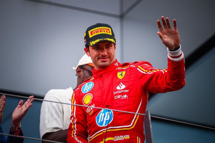 30 June 2024, Austria, Spielberg: Spanish Formula 1 drivers Carlos Sainz of the Scuderia Ferrari team 3rd position, celebrates on the podium during the F1 Grand Prix of Austria at Red Bull Ring. Photo: Federico Basile/Ipa Sport/IPA via ZUMA Press/dpa