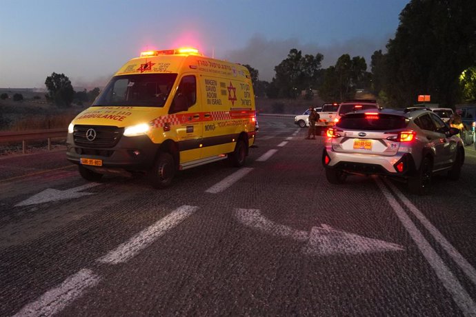 GOLAN HEIGHTS, July 9, 2024  -- An ambulance is seen near the scene of a rocket attack from Lebanon in the Israeli-occupied Golan Heights, on July 9, 2024. Two people were killed in the Israeli-annexed Golan Heights on Tuesday by rocket barrages launched 