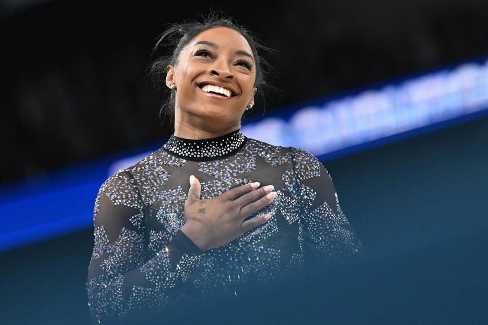 28 July 2024, France, Paris: USA's Simone Biles reacts as she competes in the women's balance beam qualifications of the Artistic Gymnastics competition at the Bercy Arena, as part of the Paris 2024 Olympic Games. Photo: Marijan Murat/dpa