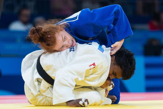 30 July 2024, France, Paris: Austrian judo practitioner Lubjana Piovesana (Blue) in action against   Mexico's Prisca Awiti Alcaraz during their Women's Quarter-final 63kg class in judo at Champ-de-Mars Arena during the Paris 2024 Olympic Games. 