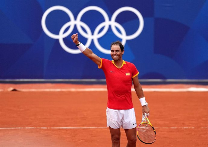 30 July 2024, France, Paris: Spanish tennis players Rafael Nadal and Carlos Alcaraz (not pictured) celebrate victory over Netherlands' Tallon Griekspoor and Wesley Koolhof (not pictured) during the men's doubles second-round match at Roland-Garros on the 