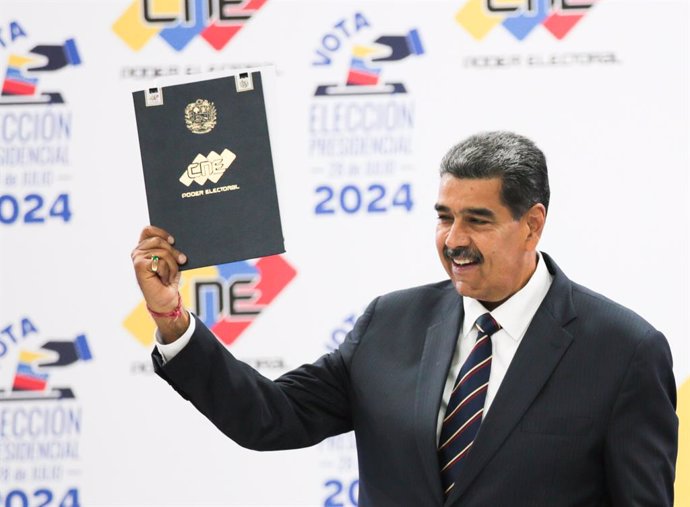 CARACAS, July 30, 2024  -- Venezuelan President Nicolas Maduro reacts during his proclamation ceremony as re-elected president of the country at the National Electoral Council in Caracas, Venezuela, July 29, 2024.