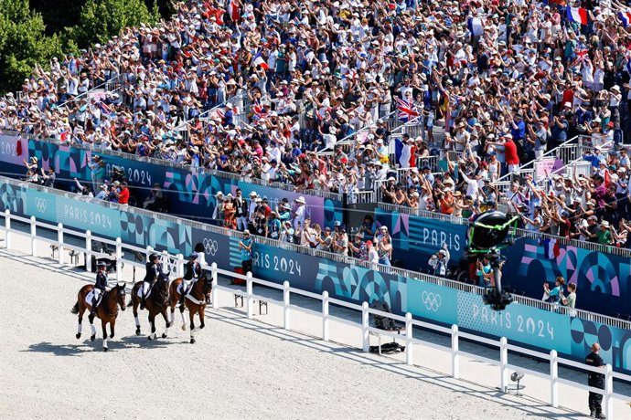 Rosalind Canter of Great Britain, Laura Collett of Great Britain and Tom McEwen of Great Britain winners of gold medal  during the Eventing Jumping Team Final and Individual Qualifier on day three of the Olympic Games Paris 2024 at Chateau de Versailles