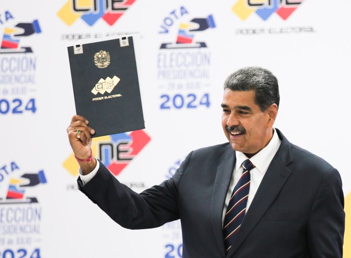 CARACAS, July 30, 2024  -- Venezuelan President Nicolas Maduro reacts during his proclamation ceremony as re-elected president of the country at the National Electoral Council in Caracas, Venezuela, July 29, 2024.   Venezuela's National Electoral Council 