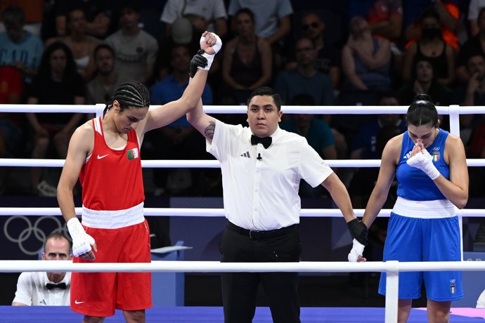 01 August 2024, France, Paris: Algeria's Imane Khelif (Red) celebrates after Italy's Angela Carini abandoned the bout during the Women's 66kg round of 16 at North Paris Arena as part of the 2024 Paris Summer Olympic Games. 