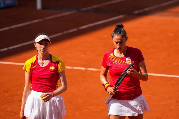 Cristina Bucsa of Spain and Sara Sorribes Tormo of Spain gesture against Mirra Andreeva and Diana Shnaider of Team Individual Neutral Athletes during Women's doubles semi-final tennis match on Court Suzanne-Lenglen at Roland-Garros Stadium during the Pa