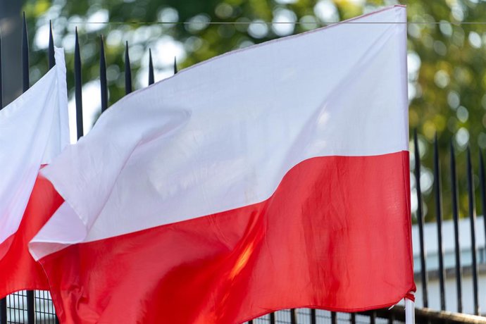 July 30, 2024, Warsaw, Poland: Polish flags seen during the rally. A protest is staged in front of the French Embassy under the slogan ''Enough of Insulting Christians!'' The demonstration opposed satanism, promotion of sexual deviations amongst others,
