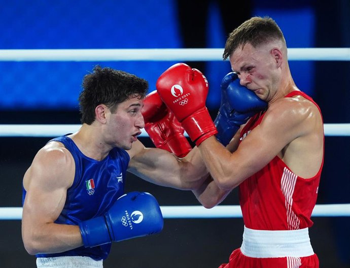 06 August 2024, France, Paris: Great Britain's Lewis Richardson (R) in action against Mexico's Marco Alonso Verde Alvarez in the Men's 71KG Semi-Final at Roland-Garros Stadium on the Eleventh day of the 2024 Paris Olympic Games. 