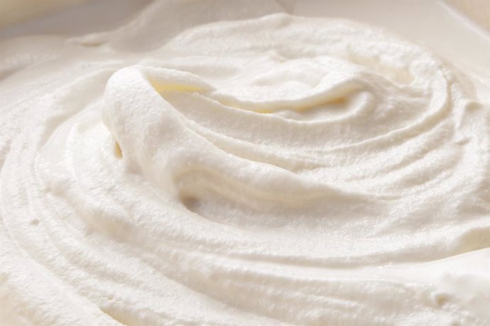 Archivo - Whipped cream close-up textured background