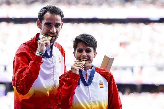 Gold medalists Maria Perez and Alvaro Martin of Spain pose after Marathon Race Walk Relay Mixed of the Athletics on Stade de France during the Paris 2024 Olympics Games on August 7, 2024 in Paris, France.