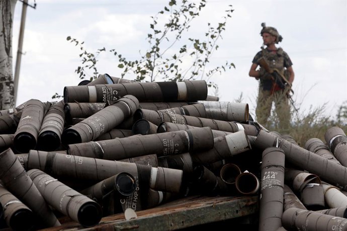 August 15, 2024, Donetsk Region, Ukraine: DONETSK REGION, UKRAINE - AUGUST 15, 2024 - An armed soldier stands behind a pile of used shells at the positions of the Motorised Rifle Battalion of the 93rd Kholodnyi Yar Separate Mechanized Brigade of the Ukrai