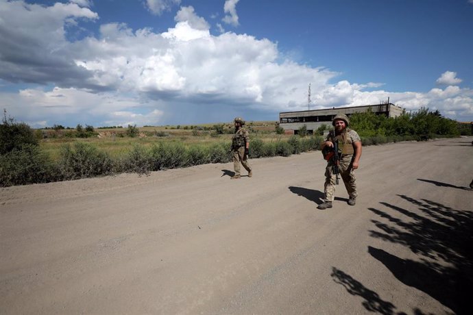 August 15, 2024, Donetsk Region, Ukraine: DONETSK REGION, UKRAINE - AUGUST 15, 2024 - Servicemen of the Motorised Rifle Battalion of the 93rd Kholodnyi Yar Separate Mechanized Brigade of the Ukrainian Armed Forces walk along a road in Donetsk region, east