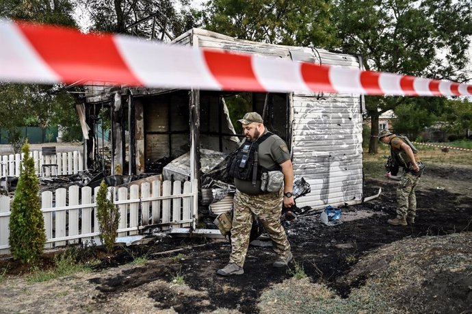 August 20, 2024, Malokaterynivka, Zaporizhzhia Region, Ukraine: MALOKATERYNIVKA, UKRAINE - AUGUST 20, 2024 - Law enforcers are outside the Levada children's cafe in the central park damaged by a Russian artillery shell strike, Malokaterynivka village, Zap