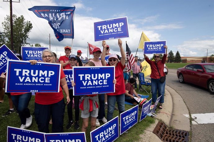 August 20, 2024, Howell, Michigan, USA: Trump supporters line the street as former President Trump visits the Livingston County Sheriff's Office to campaign in Howell.