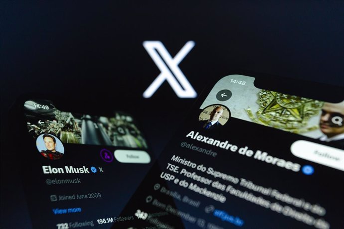 August 31, 2024, Asuncion, Paraguay: Elon Musk and Alexandre de Moraes accounts on X displayed on smartphone backdropped by X logo. Brazil started blocking Elon Musk's social media X, the platform missed a deadline imposed by Supreme Court Justice Alexand