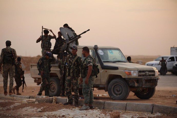 Archivo - HANDOUT - 14 October 2019, Syria, Ain Issa: A picture provided by the Syrian Arab News Agency (SANA) shows Syrian government forces enter the Al-Tabqa airbase south of Syria's Raqqa region. Syrian government forces were deployed on Monday to Kur