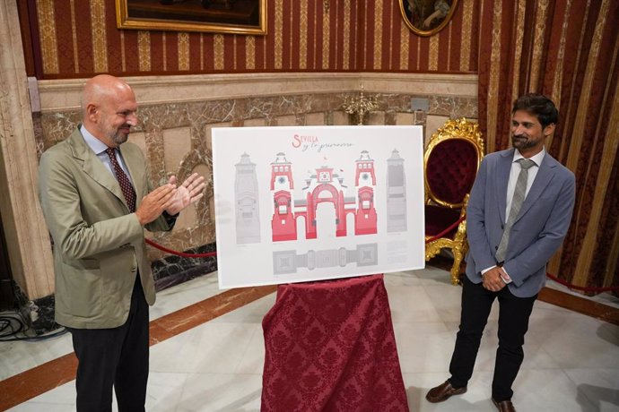 El delegado de Fiestas Mayores del Ayuntamiento de Sevilla, Manuel Alés, junto al autor de la portada el arquitecto técnico Pablo Escudero Gispert.