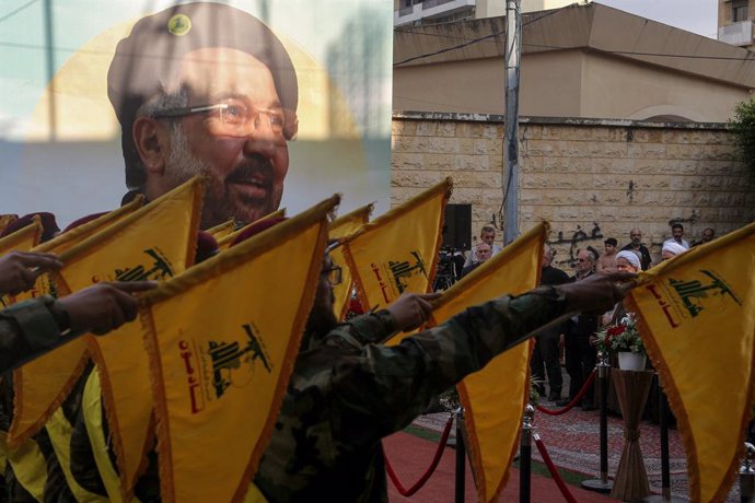 September 7, 2024, Beirut, Beirut, Lebanon: Pro-Iranian Hezbollah fighters take the oath during a ceremony to mark the 40th day of the assassination of the party top commander Fouad Shukur at a grave yard dedicated for Hezbollah militants.