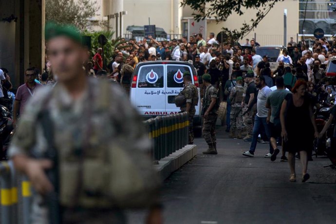 17 September 2024, Lebanon, Beirut: Lebanese army soldiers secure the area for an ambulance to enter the premises of the American University hospital. 