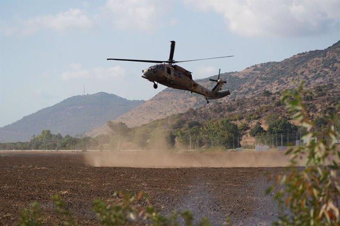 ISRAEL-LEBANON-BORDER, Sept. 19, 2024  -- An Israeli helicopter carrying injured soldiers is seen near the Israeli northern border with Lebanon, on Sept. 19, 2024. Two Israeli soldiers were killed on Thursday in cross-border drone and missile attacks carr