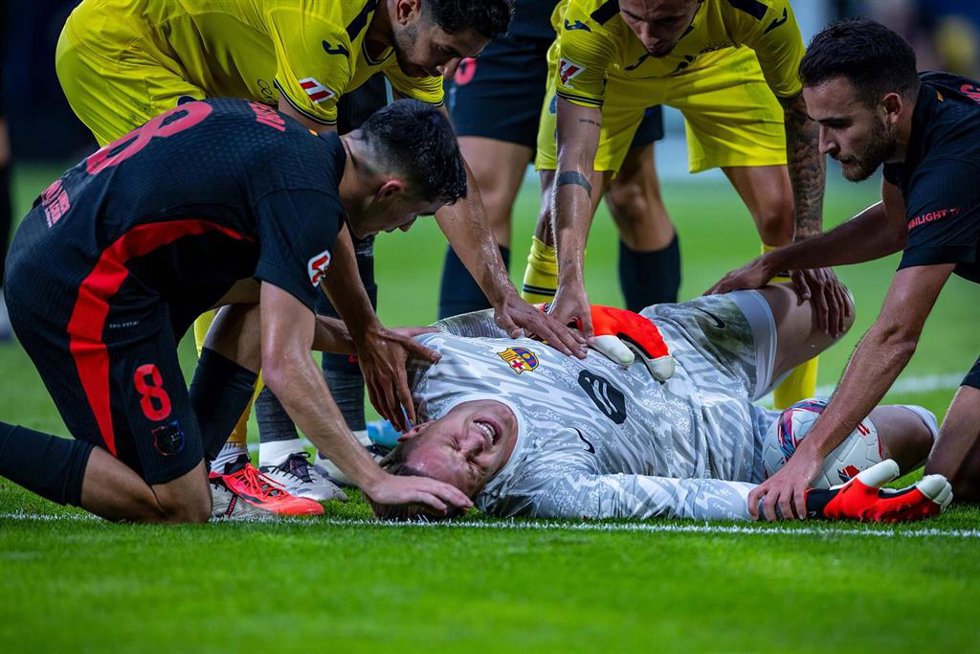 Barcelona goalkeeper Marc-Andre ter Stegen receives a treatment on the ground during the Spanish Division Primera soccer match between FC Villarreal and FC Barcelona at the Estadio de la Ceramica