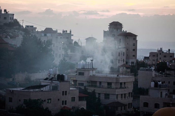 September 23, 2024, Salfit, West Bank, Palestine: Smoke seen rising from buildings after a Hezbollah rocket was fired from Lebanon, in the village of Deir Istiya, near the city of Salfit, in the northern occupied West Bank.