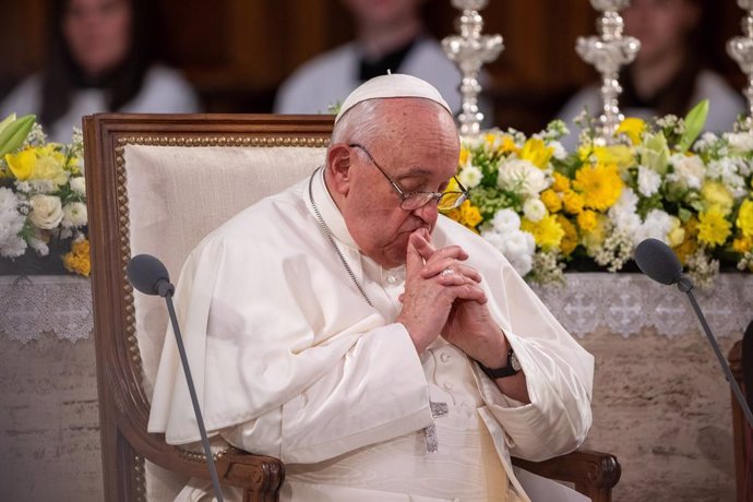 26 September 2024, Luxembourg: Pope Francis sits with folded hands in Notre Dame Cathedral during his visit to Luxembourg. Photo: Harald Tittel/dpa