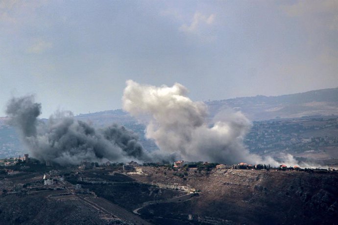 23 September 2024, Lebanon, Qliyaa: Smoke from heavy Israeli air raids billows from the southern Lebanese village of Jabal al-Rihan. Powerful air attacks were launched across much of southern Lebanon. Lebanese Health Ministry said 182 people were killed a