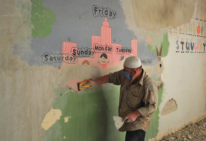 DAMASCUS, Sept. 6, 2024  -- A worker paints a wall in a school in Eastern Ghouta, east of Damascus, Syria, Sept. 5, 2024.