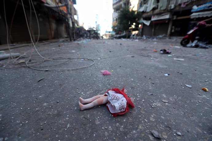 BEIRUT, Sept. 29, 2024  -- This photo taken on Sept. 29, 2024 shows a broken doll on the ground in Beirut's southern suburb, Lebanon. At least 18 people were killed and 30 others injured early Sunday in Israeli air strikes on dozens of towns and villages 