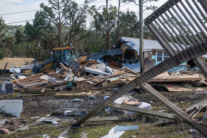 September 28, 2024, Keaton Beach, Fl, United States: U.S. Air Force airmen use heavy equipment to help clear a road and remove debris in the aftermath of Hurricane Helene, September 28, 2024 in Keaton Beach, Florida. Keaton Beach received the brunt of the