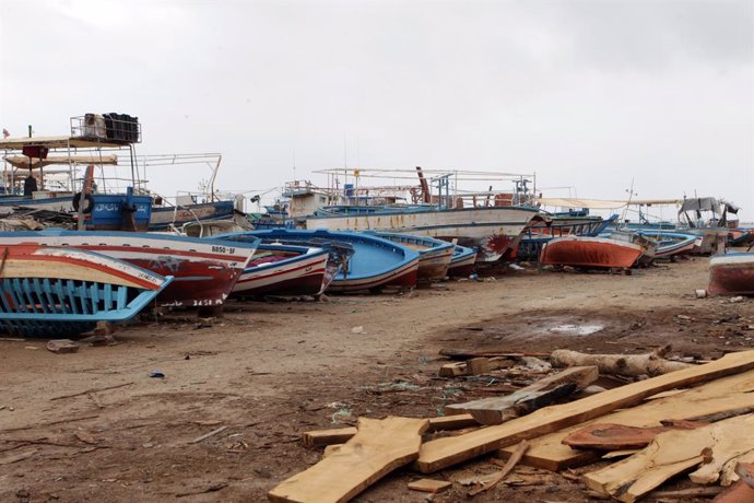 Archivo - April 28, 2024, Djebenina, Sfax, Tunisia: The remains of boats used by migrants to cross the Mediterranean to reach Italy and Europe are scattered along the port of Chebba....Migrants from sub-Saharan Africa gather near tents in a camp in Jebeni