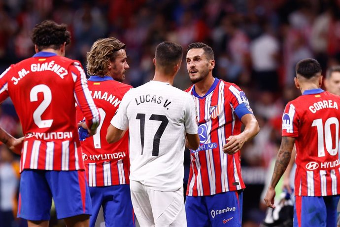 Jorge Resurreccion Koke of Atletico de Madrid talks to Lucas Vazquez of Real Madrid during the Spanish League, LaLiga EA Sports, football match played between Atletico de Madrid and Real Madrid at Civitas Metropolitano stadium on September 29, 2024, in Ma