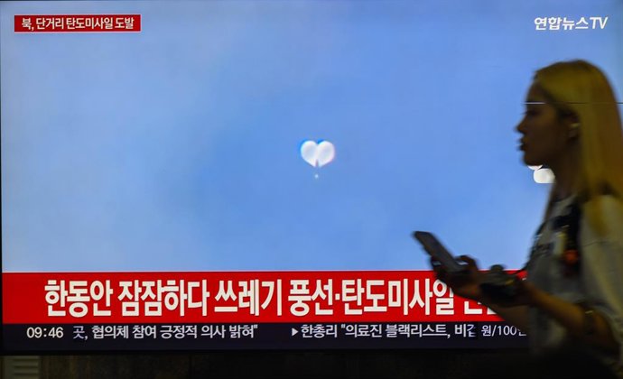 September 12, 2024, Seoul, South Korea: A 24-hour Yonhapnews TV broadcast at Yongsan Railway Station in Seoul showing a news broadcast with a file image of North Korea's balloons. North Korea fired multiple short-range ballistic missiles toward the East S