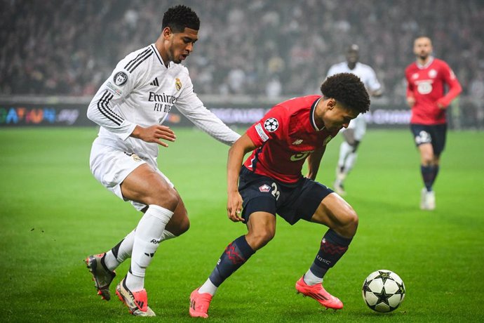 02 October 2024, France, Villeneuve-D'ascq: Lille's Tiago Santos (R) and Real Madrid's Jude Bellingham battle for the ball during the UEFA Champions League soccer match between Lille OSC (LOSC) and Real Madrid at Pierre Mauroy Stadium. Photo: Matthieu Mir