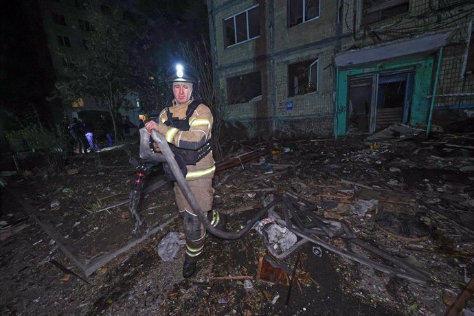 October 3, 2024, Kharkiv, Ukraine: KHARKIV, UKRAINE - OCTOBER 03, 2024 - A rescuer is seen outside the residential building damaged by a Russian guided missile strike, Kharkiv, northeastern Ukraine