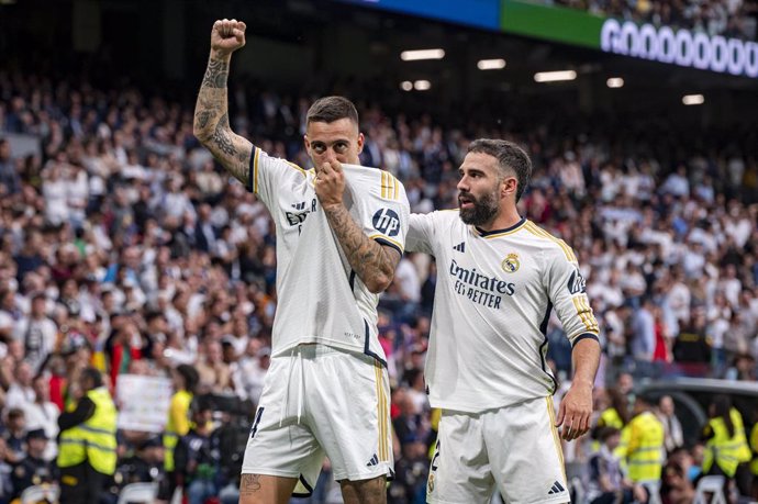 Archivo - 04 May 2024, Spain, Madrid: Real Madrids's Jose Luis Sanmartin Mato (Joselu) celebrates scoring his side's third goal with teammate Daniel Carvajal during the Spanish Primera Division La Liga soccer match between Real Madrid and Cadiz CF at Esta