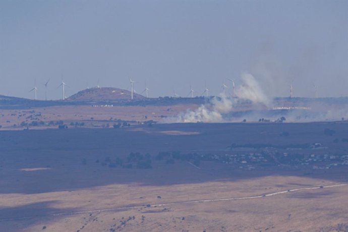 GOLAN HEIGHTS, Sept. 20, 2024  -- Smoke billows from an area hit by rockets launched from Lebanon, in the Israeli-occupied Golan Heights, on Sept. 20, 2024. Hezbollah launched over 100 rockets at more than 30 settlements in western Galilee and a key intel