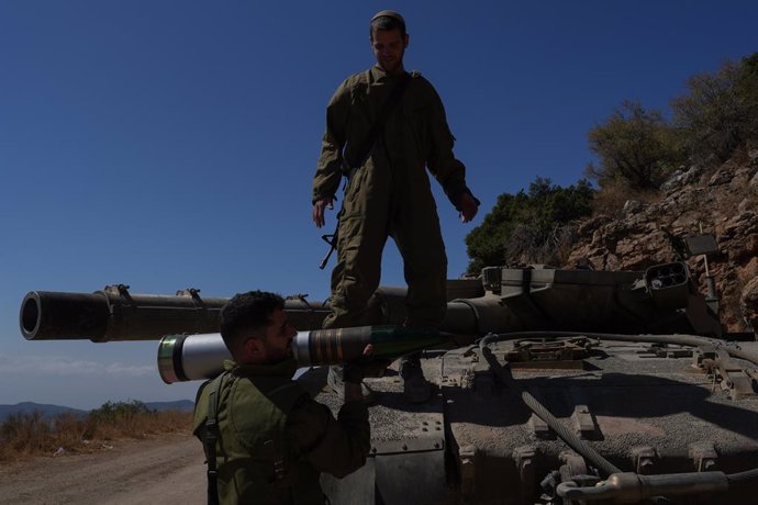 ISREAL-LEBANON BORDER, Oct. 7, 2024  -- Israeli reserve soldiers are seen at a tank staging area near northern Israeli border with Lebanon, on Oct. 7, 2024. Israel's military has declared four additional towns near the Lebanon border as a "closed military