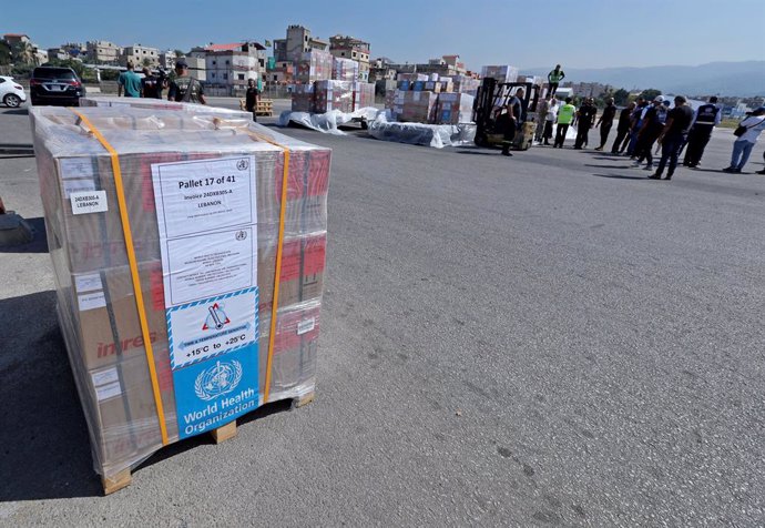 BEIRUT, Oct. 4, 2024  -- Aid provided by the World Health Organization (WHO) and the United Nations High Commissioner for Refugees (UNHCR) is unloaded at an airport in Beirut, Lebanon, on Oct. 4, 2024. An aid plane carrying 55 tons of aid and medical supp