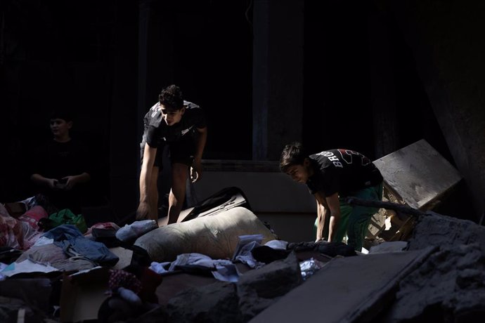 October 11, 2024, Beirut, Lebanon: Children search the rubble of a destroyed building after an Israeli strike on October 11, 2024 in Beirut, Lebanon. Local media reports at least 22 people killed and 100 wounded in the overnight strikes.