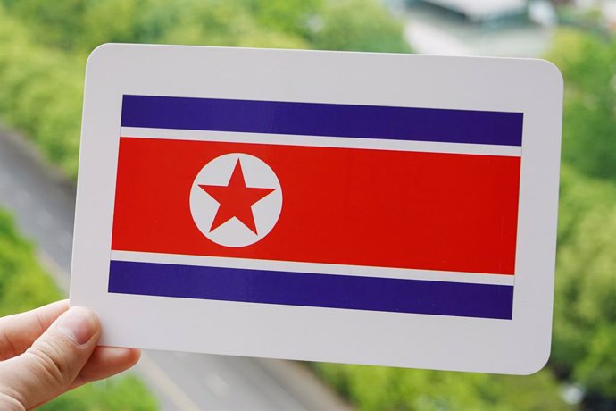 Archivo - May 10, 2022, China: In this photo illustration, the North Korea's flag is printed on a white card.