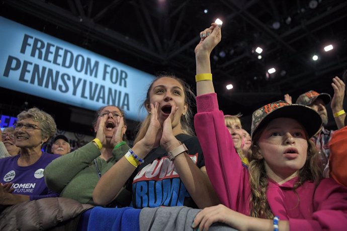 October 14, 2024, Erie, Pennsylvania, US: Supporters of Harris rally in Erie, Pennsylvania Monday night. Polls show the Democratic nominee with a slight lead over Trump with less than three weeks to go before Election Day.