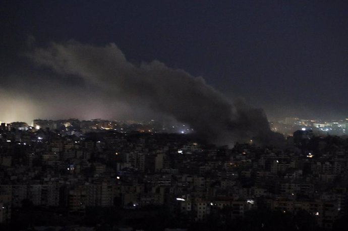 BEIRUT, Oct. 21, 2024  -- This photo taken on Oct. 20, 2024 shows smoke caused by Israeli airstrike in the southern suburb of Beirut, Lebanon. Israeli warplanes on Sunday evening began bombing branches of Al Qard Al Hassan, a financial institution affilia