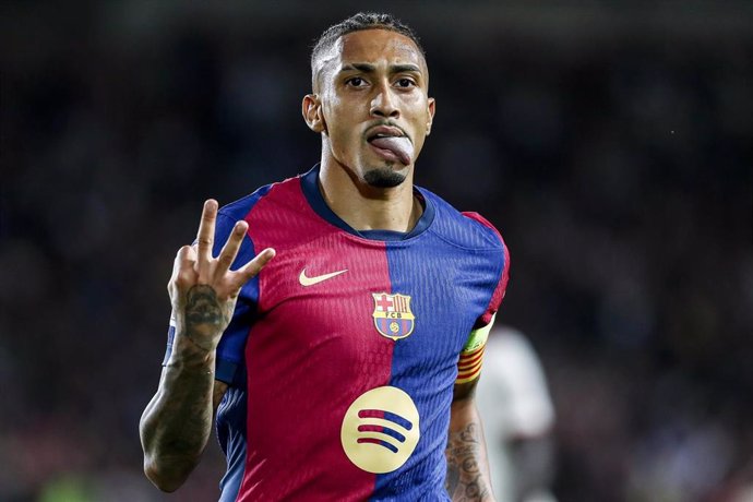 Raphinha of FC Barcelona celebrates a goal during the UEFA Champions League 2024/25 League Phase MD3 match between FC Barcelona and FC Bayern Munchen at Estadi Olimpic Lluis Companys on October 23, 2024 in Barcelona, Spain.