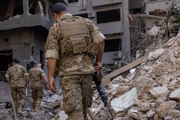 October 11, 2024, Beirut, Lebanon: Soldiers walk on the rubble of a building destroyed by an Israeli strike on October 11, 2024 in Beirut, Lebanon. Local media reports at least 22 people killed and 100 wounded in the overnight strikes.