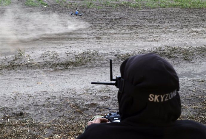 October 12, 2024, Kharkiv Region, Ukraine: KHARKIV REGION, UKRAINE - OCTOBER 12, 2024 - A 57th Otaman Kost Hordiienko Motorized Brigade drone operator launches a UAV in preparation for a combat mission, Kharkiv region, northeastern Ukraine.