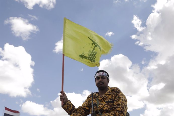 October 25, 2024, Sanaa, Sanaa, Yemen: Houthi soldier hold a Hezbollah flag as the Houthi supporters take part during a rally in solidarity with the Lebanese and Palestinian people, in Sana'a, Yemen, 25 October 2024..Amid heightened tensions in the Middle